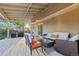 Spacious back deck with outdoor seating, grill, and direct access to the backyard at 504 E Otero Ct, Littleton, CO 80122