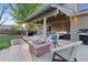 Relaxing backyard deck with seating, a fire pit, and a grill, perfect for entertaining at 504 E Otero Ct, Littleton, CO 80122