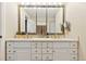 Bathroom featuring a double vanity with great lighting and lots of storage underneath at 504 E Otero Ct, Littleton, CO 80122