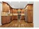Gourmet kitchen boasts custom wood cabinetry, stainless steel appliances, and granite countertops at 504 E Otero Ct, Littleton, CO 80122