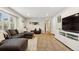 Spacious living room features plush carpeting, modern furniture, and ample natural light at 504 E Otero Ct, Littleton, CO 80122