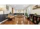 Spacious living room with hardwood floors, stylish furnishings, and ample natural light, perfect for entertaining at 504 E Otero Ct, Littleton, CO 80122
