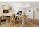 Bright home office with custom built-ins, modern desk, and a large area rug at 504 E Otero Ct, Littleton, CO 80122