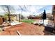 Expansive backyard featuring a deck, hammock, and grassy area, perfect for outdoor entertaining and relaxation at 7620 Hooker St, Westminster, CO 80030