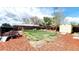 Large backyard with a well-maintained lawn, play area, shed, and perimeter privacy fence at 7620 Hooker St, Westminster, CO 80030