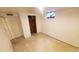 Finished basement space with a neutral color palette, offering versatility for various uses like a rec room or storage at 7620 Hooker St, Westminster, CO 80030
