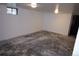 Unfinished basement featuring bare floors, white walls and ceiling lights at 7620 Hooker St, Westminster, CO 80030