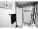Bathroom featuring an updated walk-in shower with glass enclosure and tiled walls at 7620 Hooker St, Westminster, CO 80030