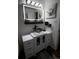 Bright bathroom with glass vessel sink, white vanity, and modern lighting at 7620 Hooker St, Westminster, CO 80030