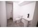 Modern bathroom featuring a pedestal sink, toilet, and clean design, offering a functional and stylish space at 7620 Hooker St, Westminster, CO 80030