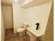 Modern half-bathroom with a sleek sink and toilet at 7620 Hooker St, Westminster, CO 80030