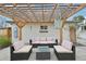 Charming back patio area featuring a pergola with stylish outdoor furniture for relaxing and entertaining at 3285 N Monaco Pkwy, Denver, CO 80207
