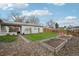 Expansive backyard features garden beds and recreational areas, perfect for Gathering activities and gardening at 3285 N Monaco Pkwy, Denver, CO 80207