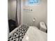 Modern bathroom featuring tile floor, shower with subway tile, and a new toilet at 3285 N Monaco Pkwy, Denver, CO 80207