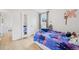 Cozy bedroom with hardwood floors, whimsical decor, and a window for natural light at 3285 N Monaco Pkwy, Denver, CO 80207