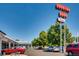 Outside of a commercial space with a Oneida Park sign and parking at 3285 N Monaco Pkwy, Denver, CO 80207