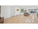 Spacious dining area with hardwood floors, ample natural light, and adjacent living space at 3285 N Monaco Pkwy, Denver, CO 80207