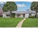 Charming home with lush front yard at 3285 N Monaco Pkwy, Denver, CO 80207