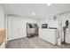 Finished basement laundry area featuring a pet washing station and new washer and dryer at 3285 N Monaco Pkwy, Denver, CO 80207