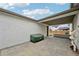 A neutral tone brick patio with a covered outdoor living space perfect for relaxing or entertaining at 3285 N Monaco Pkwy, Denver, CO 80207