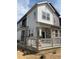 Beautiful two-story home with stone accents, neutral siding, and a charming front porch at 1988 S Haleyville Way, Aurora, CO 80018