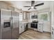 Modern kitchen featuring stainless steel appliances, ample counter space, and stylish light fixtures at 7833 Raritan St, Denver, CO 80221