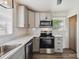 Modern kitchen featuring stainless steel appliances and bright light at 7833 Raritan St, Denver, CO 80221