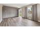 Inviting living room featuring modern floors, contemporary wall accents, and natural lighting at 7833 Raritan St, Denver, CO 80221
