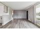 Spacious living room featuring modern floors and access to the kitchen at 7833 Raritan St, Denver, CO 80221