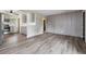 Spacious open-concept living area featuring modern floors and access to the kitchen at 7833 Raritan St, Denver, CO 80221