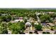 An eye-level aerial shot highlights the mature trees in the neighborhood that surrounds this home at 3743 N Yates St, Denver, CO 80212