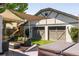 Outdoor patio featuring stylish seating, shade sails, a hot tub, and a detached two-car garage at 3743 N Yates St, Denver, CO 80212