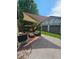 Outdoor patio offers sunshades, detached garage, and seating arrangement for entertaining and relaxing at 3743 N Yates St, Denver, CO 80212