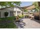 Relax in this outdoor living space, complete with comfortable seating and shade sails over a stamped concrete patio at 3743 N Yates St, Denver, CO 80212