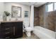 Chic bathroom featuring a modern vanity, toilet, and bathtub with stylish tile accents at 3743 N Yates St, Denver, CO 80212