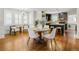 Open dining area with hardwood floors connecting living and kitchen spaces at 3743 N Yates St, Denver, CO 80212