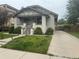 Beautiful single-story painted brick home featuring a well-manicured lawn and private driveway at 3743 N Yates St, Denver, CO 80212