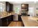 Well-equipped kitchen with stainless steel appliances and stylish backsplash at 3743 N Yates St, Denver, CO 80212