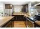 Modern kitchen features stainless steel appliances, custom cabinets, and stylish backsplash for a contemporary design at 3743 N Yates St, Denver, CO 80212