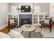 Inviting living room featuring a fireplace, built-in cabinets, and stylish furnishings at 3743 N Yates St, Denver, CO 80212