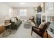 Comfortable living room with hardwood floors, a fireplace, and ample seating at 3743 N Yates St, Denver, CO 80212