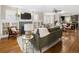 Open-concept living area with hardwood floors, fireplace, and abundant natural light at 3743 N Yates St, Denver, CO 80212