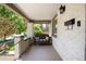 Inviting front porch with a comfortable bench, perfect for enjoying the outdoors at 3743 N Yates St, Denver, CO 80212