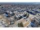 Community aerial view showcasing residential buildings, parking, and surrounding streets at 6380 Oak St # 107, Arvada, CO 80004