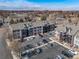 A lovely aerial view of this condo community with beautiful landscaping and convenient parking at 6380 Oak St # 107, Arvada, CO 80004