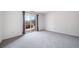 Bright bedroom featuring plush carpeting and sliding glass doors at 6380 Oak St # 107, Arvada, CO 80004