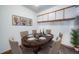 Elegant dining room featuring a stylish table set for six with modern decor and ample storage at 6380 Oak St # 107, Arvada, CO 80004