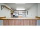 A well-lit kitchen is equipped with modern, stainless steel appliances at 6380 Oak St # 107, Arvada, CO 80004