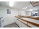 Kitchen equipped with stainless steel sink and white appliances at 6380 Oak St # 107, Arvada, CO 80004