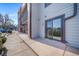 Patio and sliding glass doors on the exterior of the property at 6380 Oak St # 107, Arvada, CO 80004